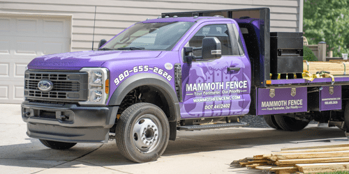 Fence contractor truck parked on site