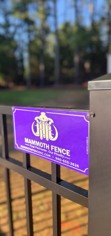 mammoth fencing placard on a newly installed ornamental aluminum fence